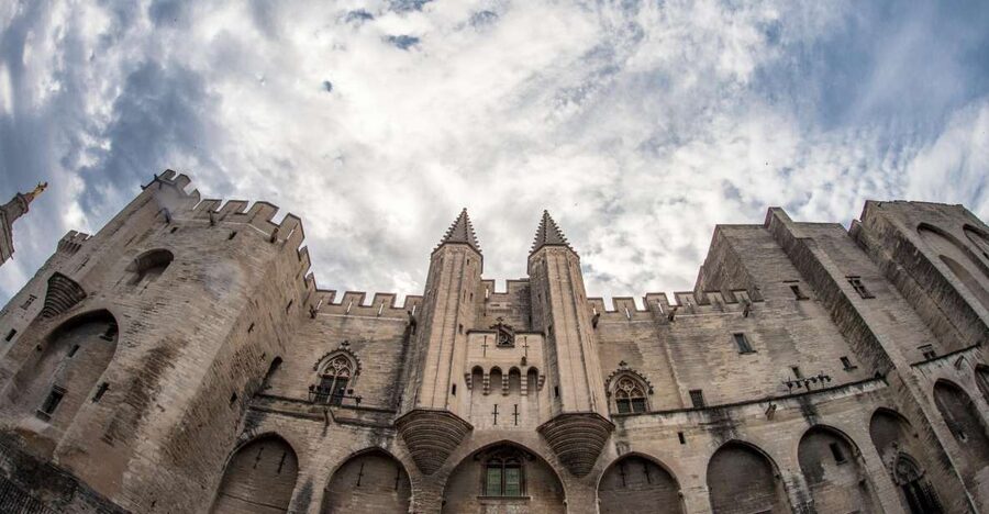 Avignon: City Walking Tour with Popes Palace Entry - Place de l’Horloge: painted windows and the clock-tower heart
