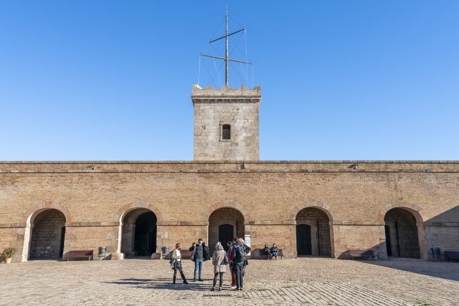 Barcelona: Walking tour with Montjuic Castle & Cable Car - Returning to the Old Town via cable car and ending at El Molino