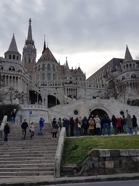 Budapest: Castle District Walking Tour - Huskies and humor: statues, huszár light cavalry, and quick trivia you’ll remember