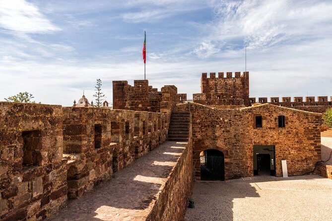 From Albufeira: Benagil Tour, Bones & Medieval Silves Castle - Stop 1: Praia de Nossa Senhora da Rocha and the cliff chapel vibe
