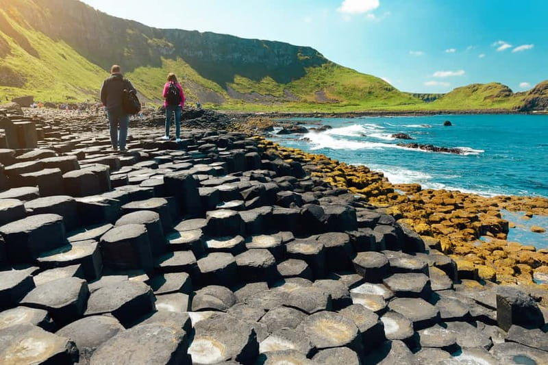 From Belfast: Giant's Causeway Guided Day Tour With Castles - Along the Antrim Coast Road: villages, viaducts, and potential dolphins