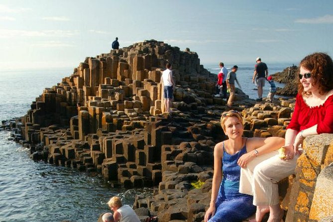 From Belfast-Giants Causeway, Dunluce Castle and Dark Hedges tour - Stop 1: Dunluce Castle, 5 minutes for cliff-edge photos