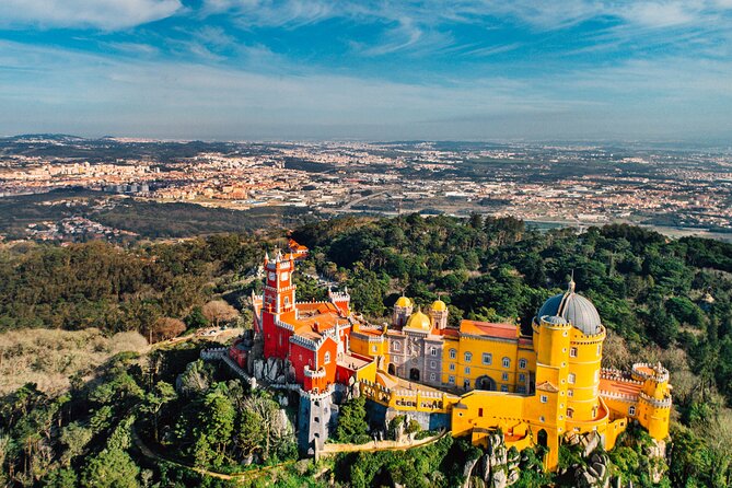 From Lisbon: Small Group to Pena Palace, Nazaré & Fátima - Return drive past Lisbon’s iconic squares: a last look before drop-off