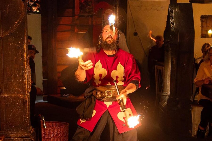 From Prague: Medieval Dinner, Show, Castle and Brewery - The Medieval Experience show: music, juggling, snake fakir, and fire finale