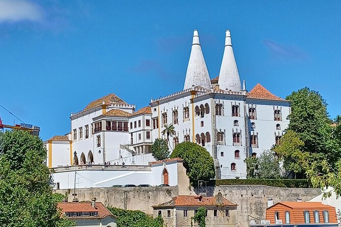 Group to Pena Palace, Sintra (pass by Regaleira) and Cascais - Sintra village hour: quick orientation and a Monteiro-era viewpoint