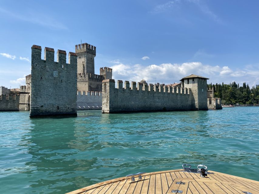 Lake Garda: Historic Castle Cruise with Wine Tasting - Torri del Benaco and the Roman-origin castle vibe