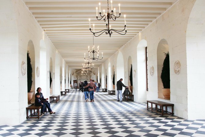 Loire Valley Castles Day Trip from Paris with Complementary Wine - Chenonceau Castle: the river-spanning main hall and the wine-cellar tasting