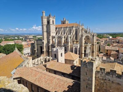 Narbonne: visit the Archbishops' Palace and Cathedral - Palais des Archevêques: courtyards, façade clues, and the Grand Staircase