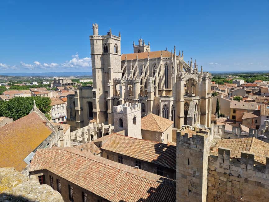 Narbonne: visit the Archbishops' Palace and Cathedral - Palais des Archevêques: courtyards, façade clues, and the Grand Staircase