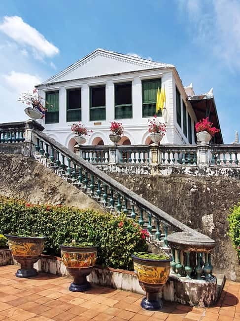 Petchaburi Temples & Royal Palace - small Join Group Tour - Khao Luang Cave Temple: where light shafts meet Buddha statues