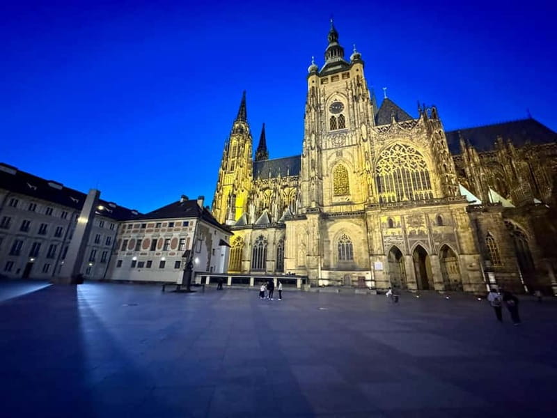Prague: Night Walk through Prague Castle with City Views - Rudolf II’s courtyard: crystal chandeliers and courtly drama