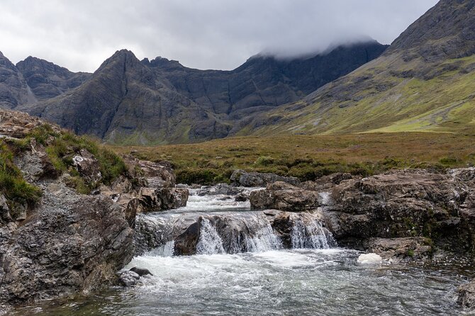 Skye Day Tour from Inverness with Fairy Pools & Dunvegan Castle - Portree break: lunch, shops, and the harbor photo moment