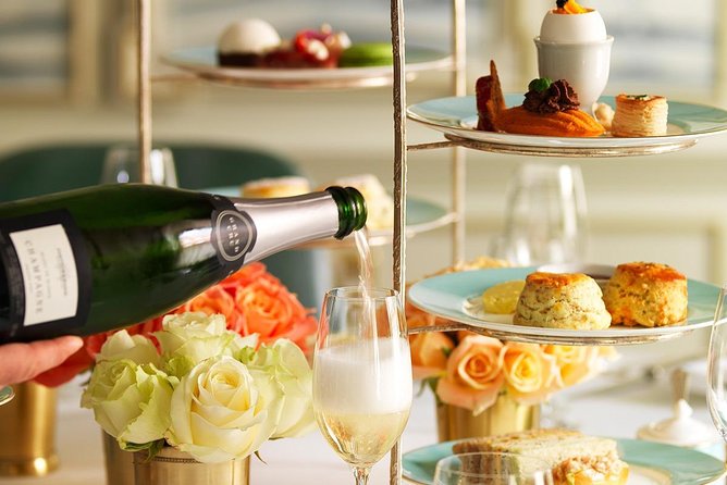 The Kensington Palace Gardens Royal High Tea - The tea spread: sandwiches, scones, and Victoria Sponge
