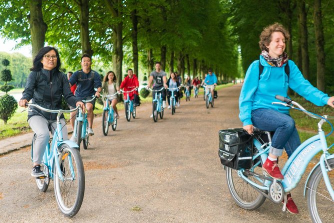 Versailles Palace Bike Tour with Market & Marie-Antoinette hamlet - Royal forests and fountains: hunting stories and Sun King symbols